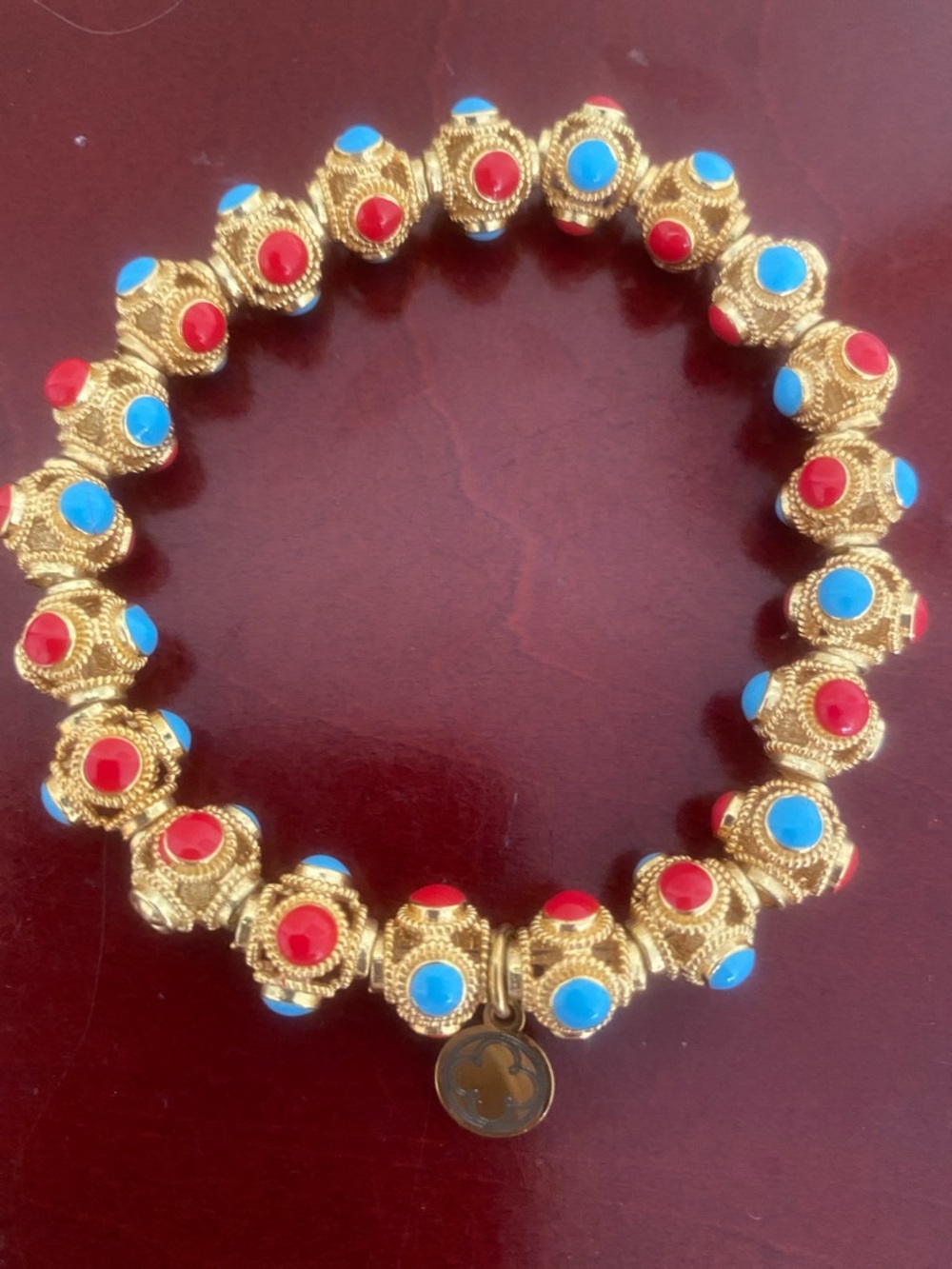 Gold-Tone Stretch Bracelet with Red and Blue Accents